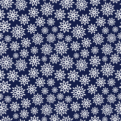 Indigo and white floral seamless vector pattern. Little white outlined geometric flowers on a navy blue background. Simple all over print, repeating design. Suitable for textile, paper and packaging.