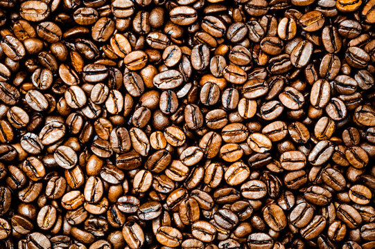 Roasted coffee or espresso beans background. Colorful table top view. © Marcus Friedrich