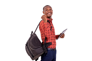 young man holding digital tablet and carrying his backpack smiling.