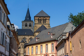Fototapeta na wymiar Closeup cityscape courtyard view of churches and buildings in the UNESCO World Heritage city center of Trier, Germany