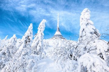 Ještěd hotel on a hill in winter with a snow cover