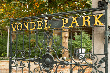 Golden letters on the gate at the entrance to the Vondelpark, near the Leidseplein in Amsterdam, the Netherlands.
