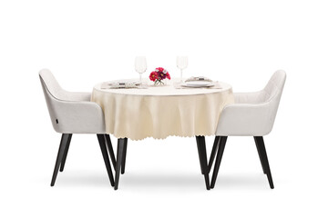 Round restaurant table with a cloth set for two persons