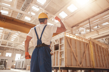 Athletic male builder demonstrating his muscular arm