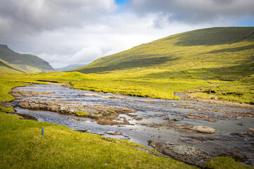 stream in mountains, faroe islands, streymoy, north atlantic, europe