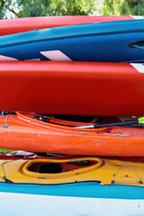 Set of colorful kayaks outdoors on beach coast