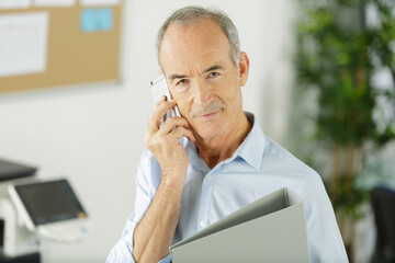 a happy boss using smartphone