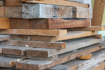 Stack of wooden studs at a lumber yard, close up photo