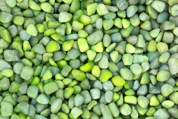 Light green texture of natural small mineral rock stones gemstone particles. Decorative Stone pebbles for coating in the garden. Extreme close up of heap top view