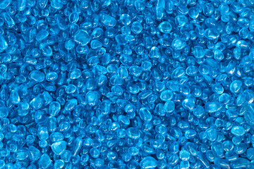 texture of Light Blue natural small mineral rock stones gemstone particles. Decorative Stone pebbles for coating in the Aquarium or garden. Extreme close up of heap top view