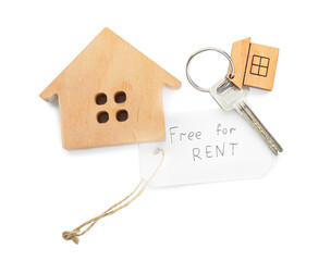 Wooden house, key with keychain and text FREE FOR RENT on white background