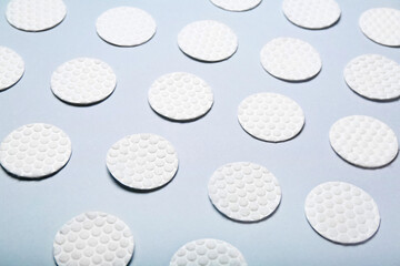 Clean cotton pads on color background