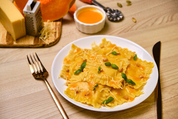 Homemade Pumpkin Ravioli with ricotta cheese served basil