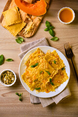 Homemade Pumpkin Ravioli with ricotta cheese served basil