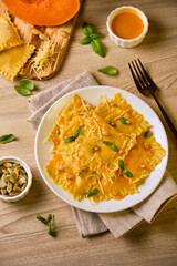 Homemade Pumpkin Ravioli with ricotta cheese served basil