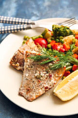 Plate with tasty baked cod fillet and vegetables on color background, closeup