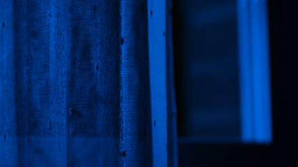 Blue window with light coming throw. Blue lightcoming in. Night. Moonlighty.