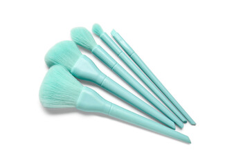 Set of stylish makeup brushes on white background