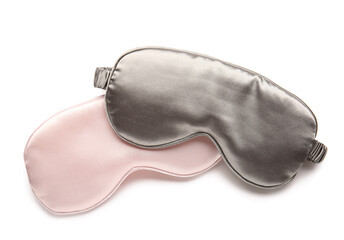 Stylish sleep masks on white background