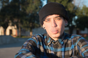 Young white hipster smoking outdoor
