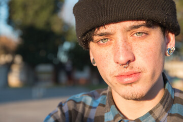 Portrait of a young Argentinian hipster with freckles
