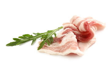 Slices of uncooked bacon with arugula on white background