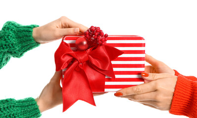 Hands with Christmas gift on white background