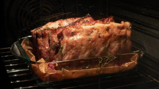 Cooking pork ribs inside oven. Closeup