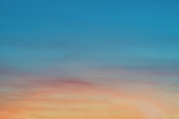 Obraz premium Summer evening sky in the picturesque clouds, lit by the rays of the setting sun.