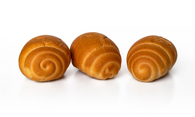 Soft rolls with a golden crust, rolled into a roll, on a white background