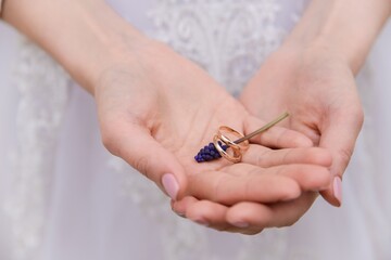 wedding rings in hands