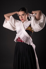 Young beautiful slovak woman in traditional dress. Slovak folklore