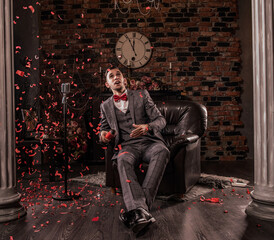 man in formal suit with flapper confetti