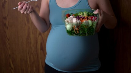 asian pregnant women eating healthy salad