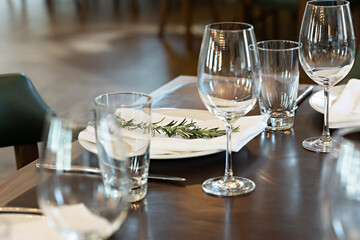 Brown wooden restaurant table ready to be served