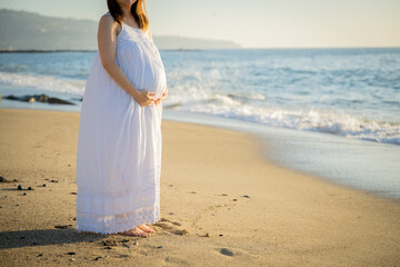 Fototapeta na wymiar pregnant asian women on the beach