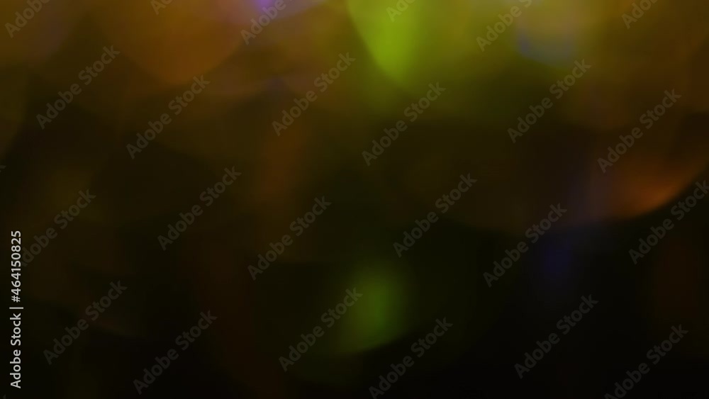 Canvas Prints huge golden bokeh in a row shimmer from bottom to top on a black background. the line of yellow mixi