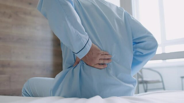 Male pensioner feeling back pain, symptom of osteoarthritis, joints degeneration