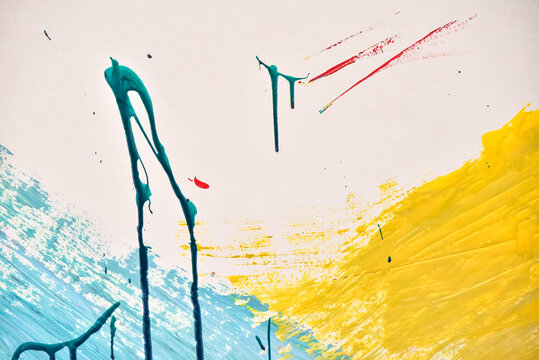 White paper with colorful abstract paintings on it