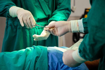 Operation surgical urgency.Medical team give scissors for open  wound