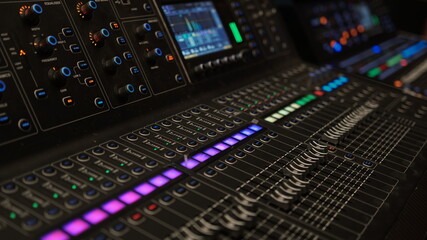 Fototapeta premium Black digital audio mixer. Focus selected on the slider button