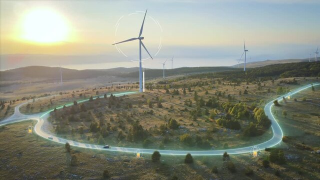 Wind turbines generating power and animation of sending electrical energy to EV's driving on roads. Aerial.