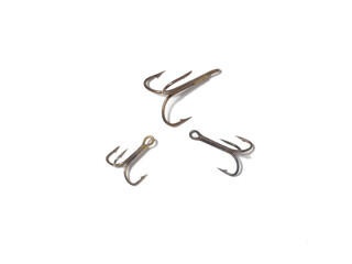 Triple hooks on a white background. Fishing.
