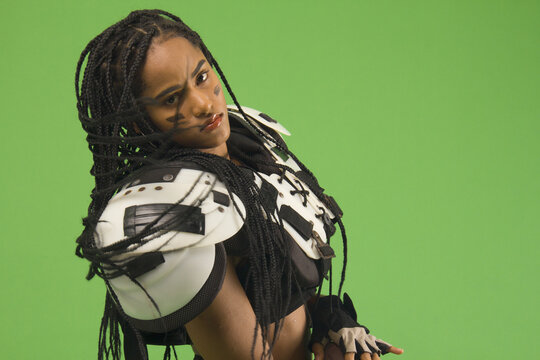 Woman With Sportswear, American Football, Shoulder Pads, Ball And Braids