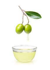 Olive oil dripping from olives fruit isolated on white.	
