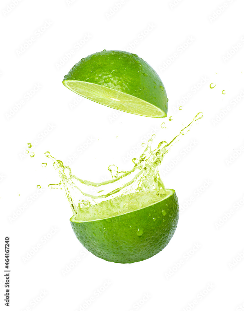 Wall mural Lime juice splashing isolated on white