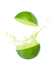 Lime juice splashing isolated on white