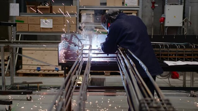 Professional Welder Working Industrial Manufacturing Factory. Slow Motion
