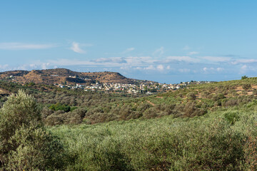 View to the village Pitsidia, located hillside near the mediterranean sea and at the end of Messara plain in the south of Crete. Despite the tourism it has kept its original rural character