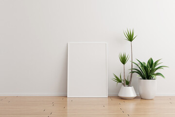 White vertical photo frame mockup on white wall empty room with plants on a wooden floor